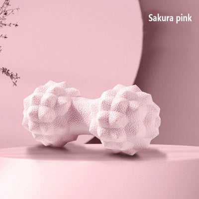 boule de massage rose sur un meuble