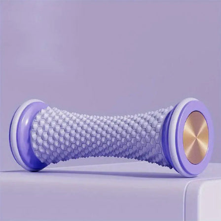 Rouleau de massage violet poser sur un meuble