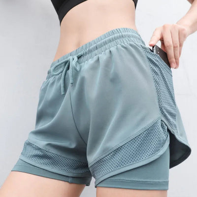Short de sport femme couleur verte vec poche pour telephone