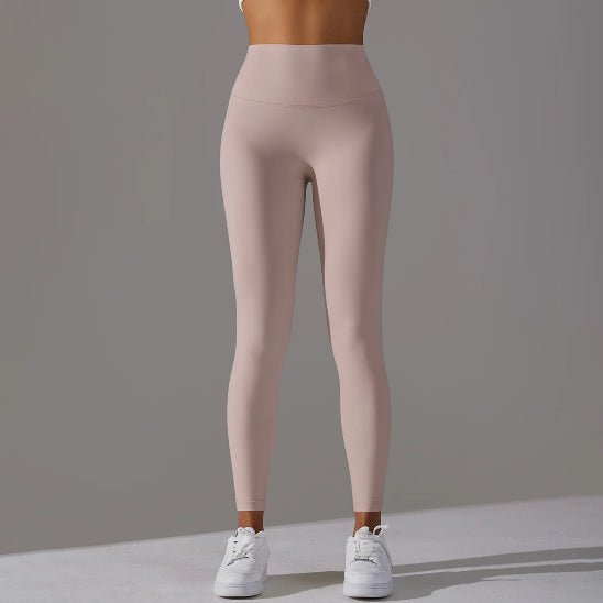 Rose legging sport femme debout