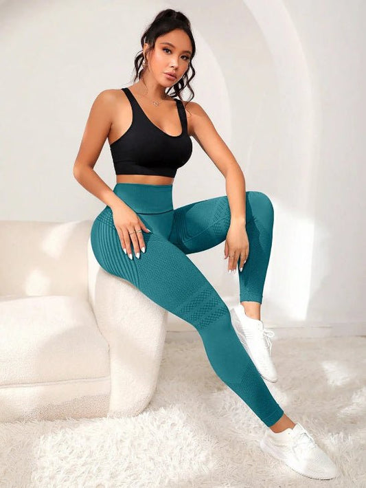Legging sport vert femme assise